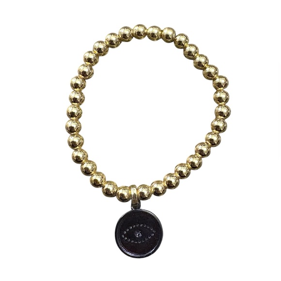 Gold tone beaded elastic bracelet with black and rhinestone evil eye pendant - Picture 3 of 4
